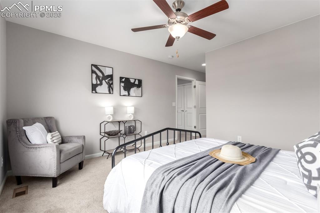 7956 Osage Street Denver, CO 80221 - Photo 18 of 48 Carpeted bedroom with a ceiling fan and baseboards