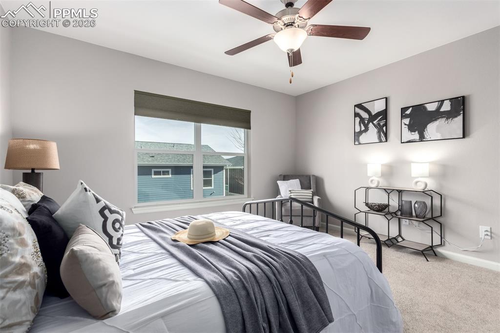 7956 Osage Street Denver, CO 80221 - Photo 19 of 48 Carpeted bedroom with a ceiling fan and baseboards