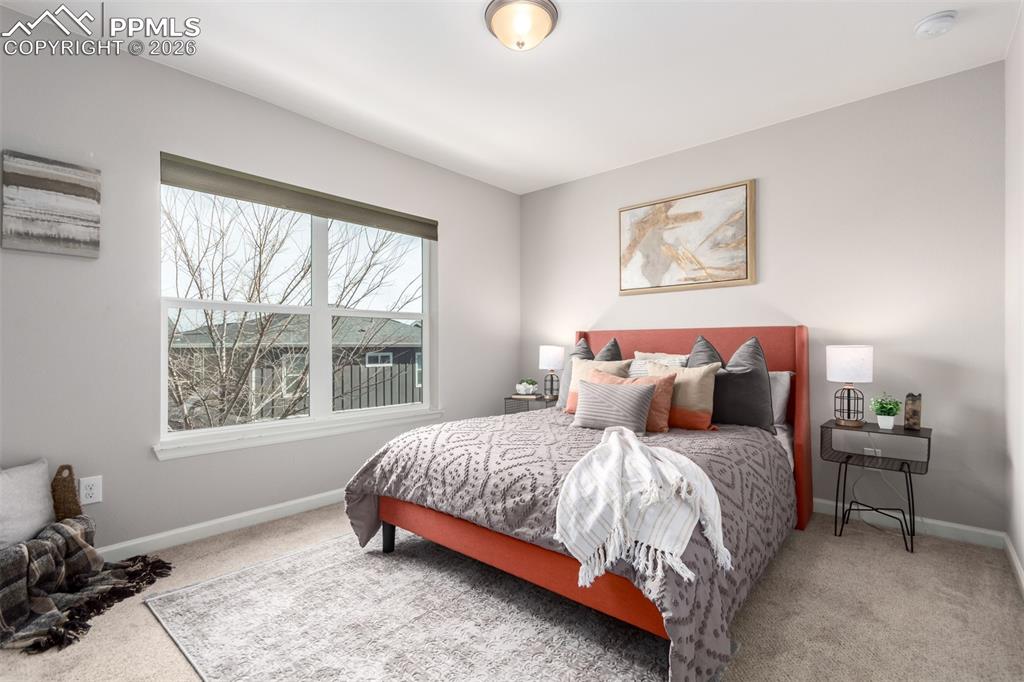 7956 Osage Street Denver, CO 80221 - Photo 25 of 48 Carpeted bedroom with baseboards