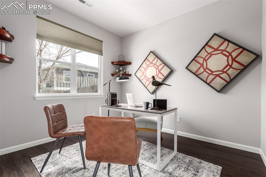 7956 Osage Street Denver, CO 80221 - Photo 29 of 48 Home office with baseboards and dark wood-type flooring