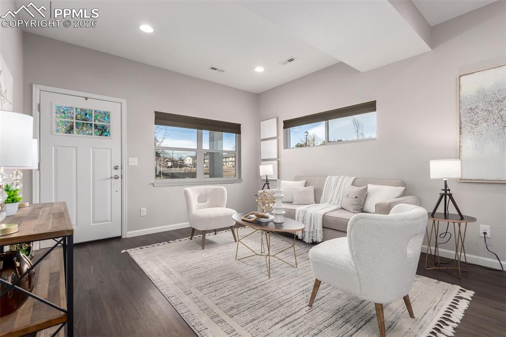 7956 Osage Street Denver, CO 80221 - Photo 3 of 48 Living area with healthy amount of natural light, dark wood-type flooring, and recessed lighting