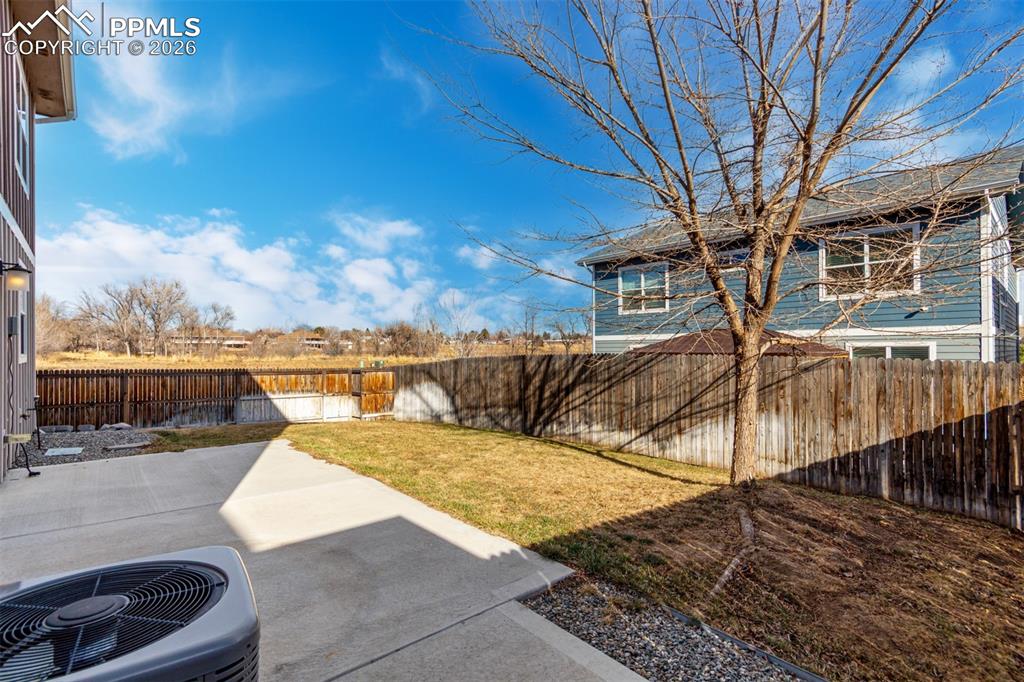 7956 Osage Street Denver, CO 80221 - Photo 31 of 48 Fenced backyard featuring a patio area