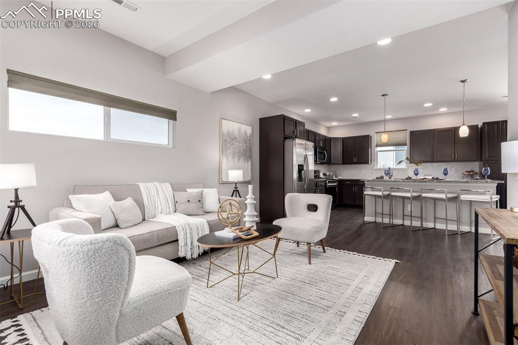 7956 Osage Street Denver, CO 80221 - Photo 4 of 48 Living area featuring dark wood-style flooring and recessed lighting