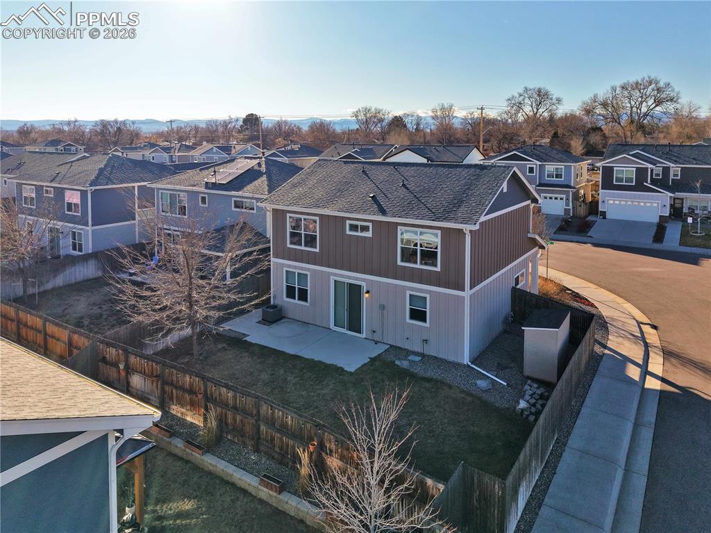 7956 Osage Street Denver, CO 80221 - Photo 42 of 48 a view of a large building with a yard