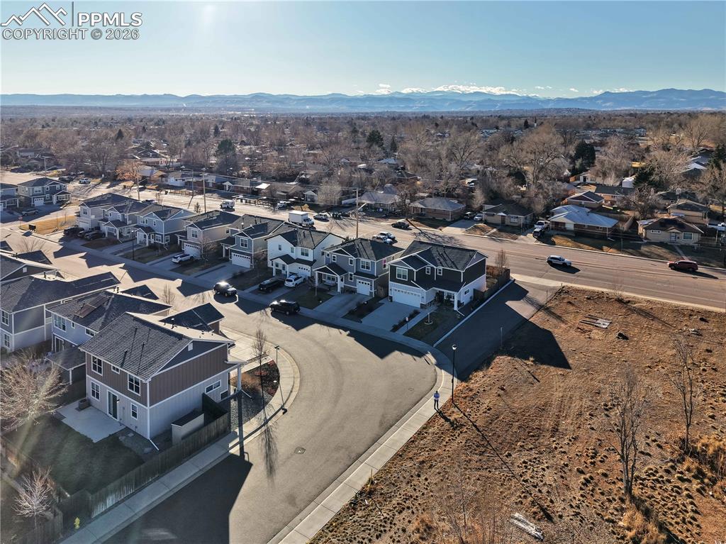 7956 Osage Street Denver, CO 80221 - Photo 44 of 48 Aerial view of residential area with a mountain backdrop