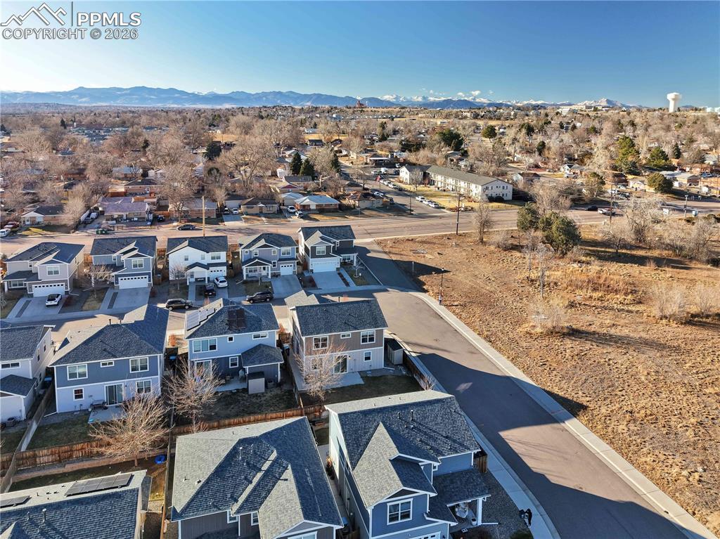 7956 Osage Street Denver, CO 80221 - Photo 47 of 48 Aerial view of residential area featuring a mountain backdrop