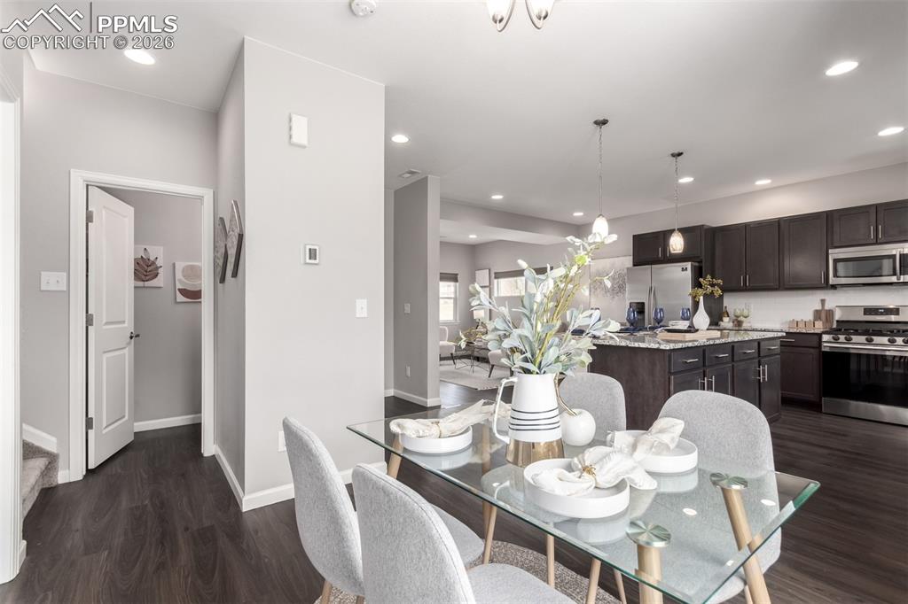 7956 Osage Street Denver, CO 80221 - Photo 8 of 48 Dining space with dark wood finished floors and recessed lighting