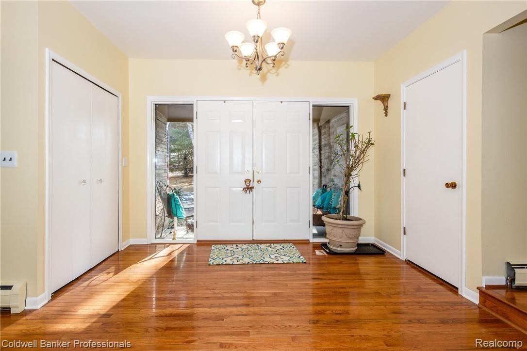 4777 Six Mile Road South Lyon, MI 48178 - Photo 12 of 71 A statement foyer with large coat closet