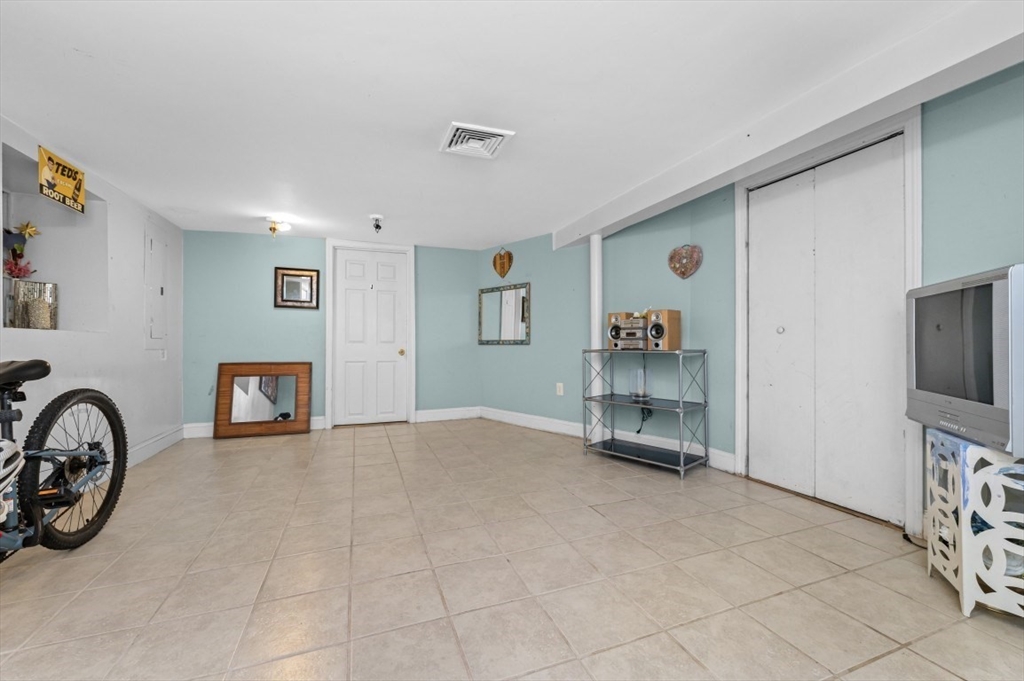15 Murray Hill Road Medford, MA 02155 - Photo 24 of 30 a view of a livingroom with furniture and a flat screen tv