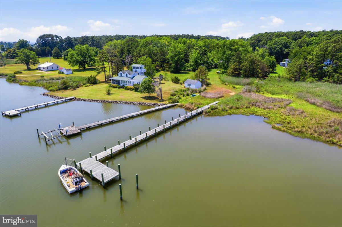 16146 Thomas Road Piney Point, MD 20674 - Photo 2 of 70 an aerial view of a house with a garden and lake view
