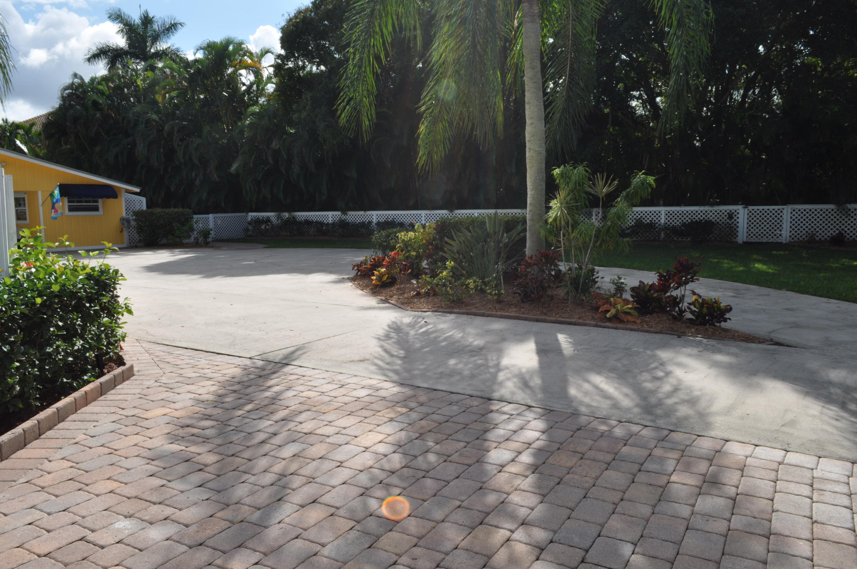 114 Faith Way Jupiter, FL 33458 - Photo 3 of 36 DRIVEWAY WITH ISLAND