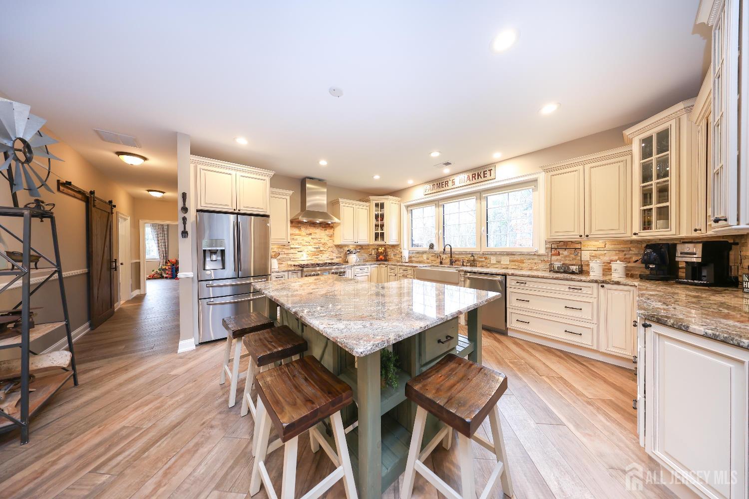 94 East Pleasant Grove Road Jackson, NJ 08527 - Photo 20 of 59 a large kitchen with a table and chairs