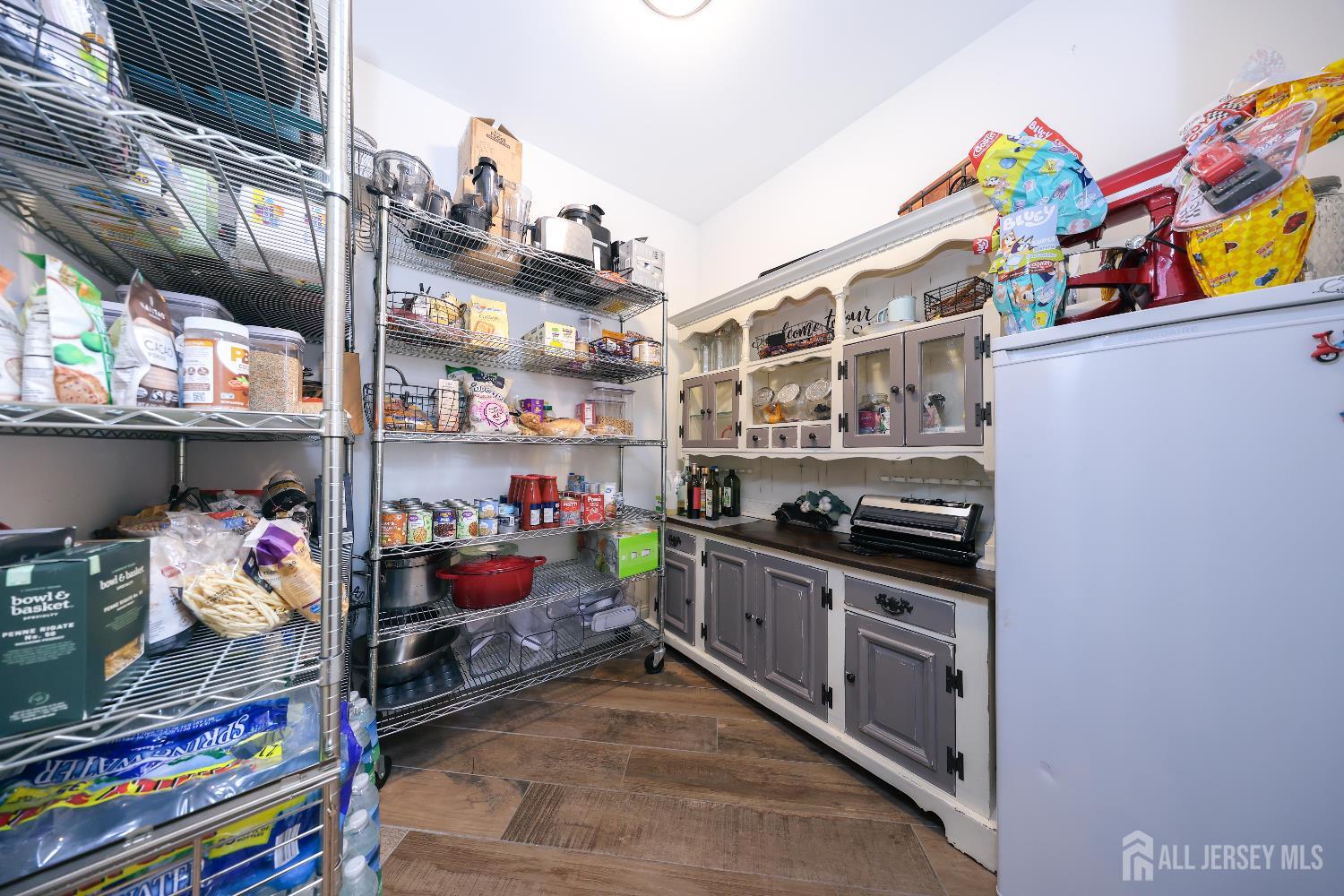 94 East Pleasant Grove Road Jackson, NJ 08527 - Photo 25 of 59 a kitchen filled with lots of clutter and cabinets