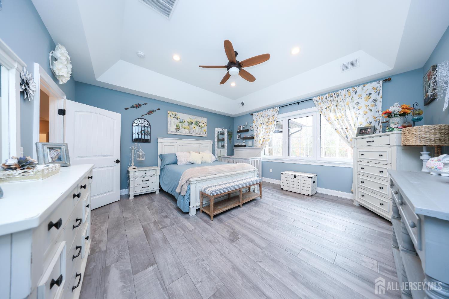 94 East Pleasant Grove Road Jackson, NJ 08527 - Photo 26 of 59 a spacious bedroom with a bed and a dresser