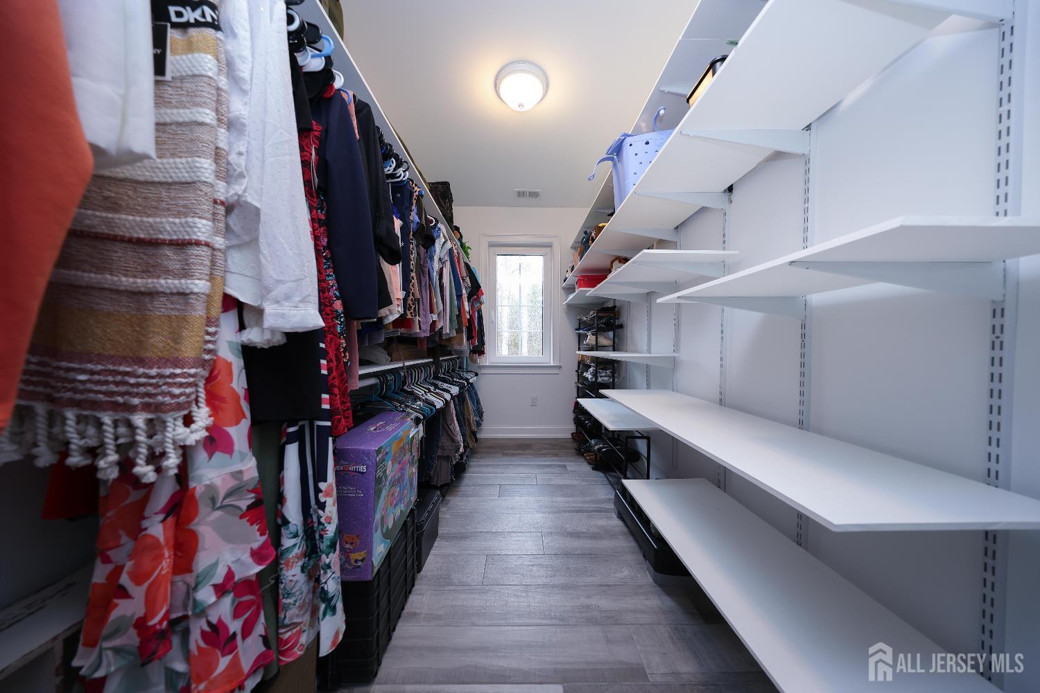 94 East Pleasant Grove Road Jackson, NJ 08527 - Photo 29 of 59 a hallway with lots of stuff and furniture