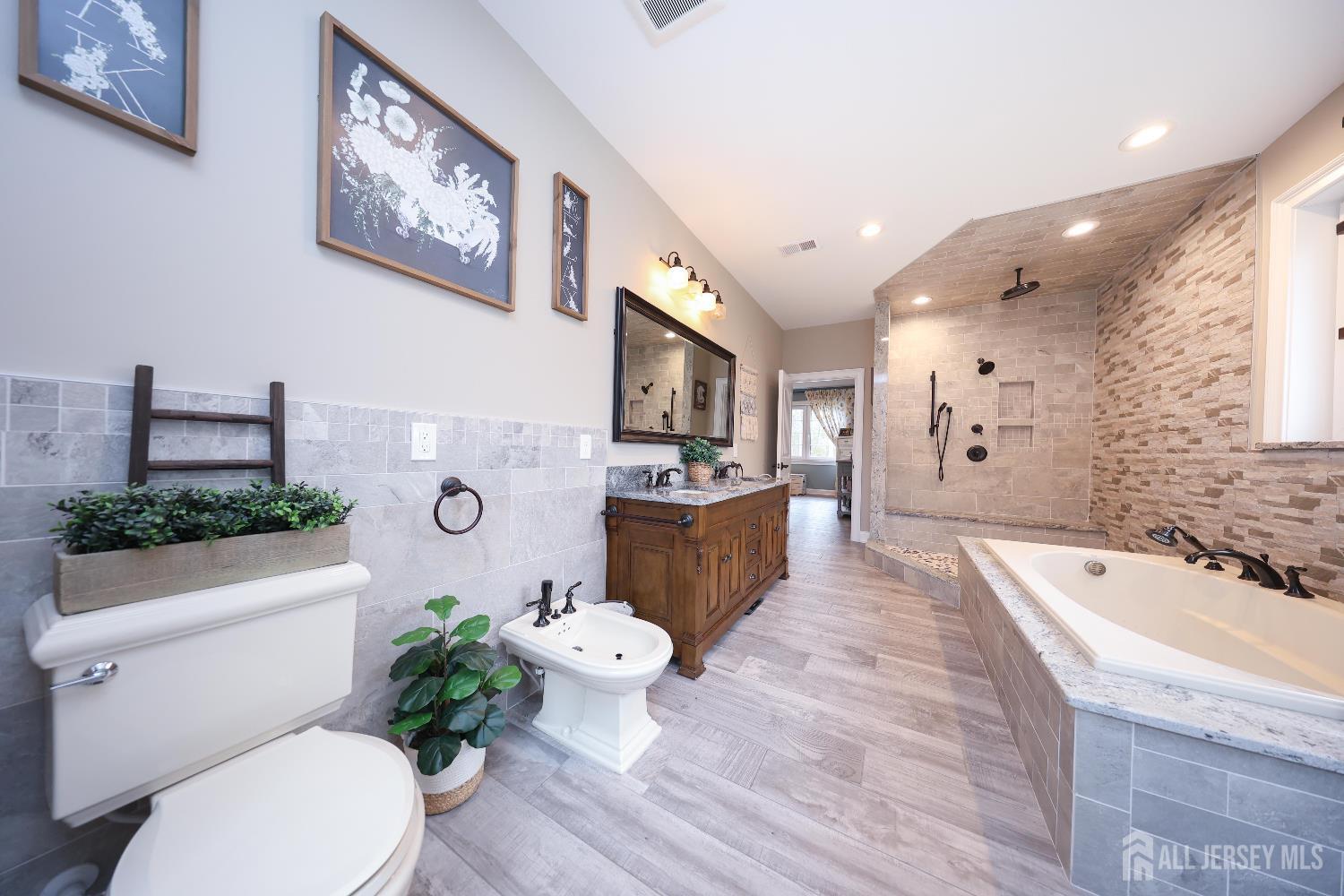 94 East Pleasant Grove Road Jackson, NJ 08527 - Photo 31 of 59 a spacious bathroom with a tub sink mirror and toilet