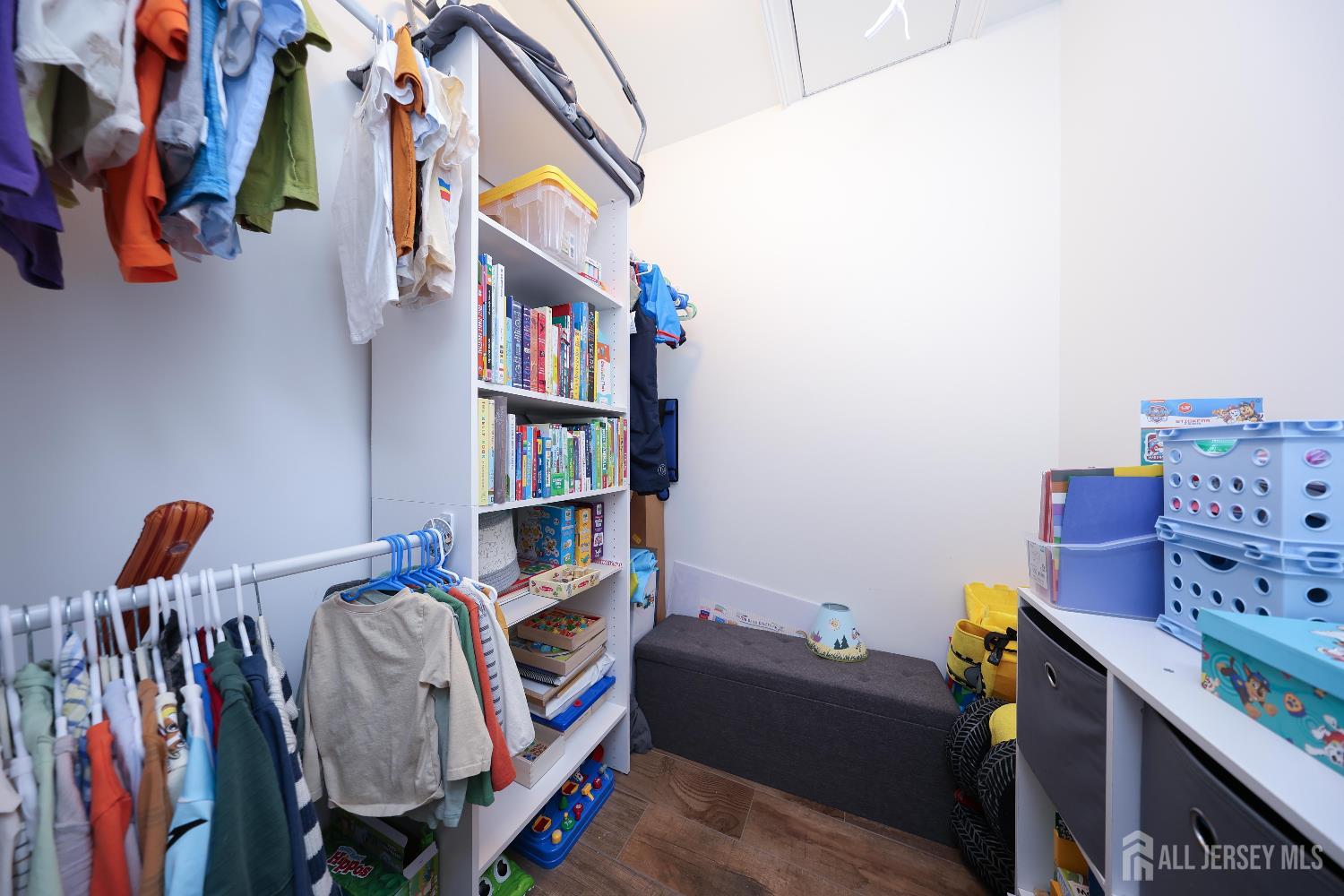 94 East Pleasant Grove Road Jackson, NJ 08527 - Photo 36 of 59 a view of walk in closet with clothes and shoes