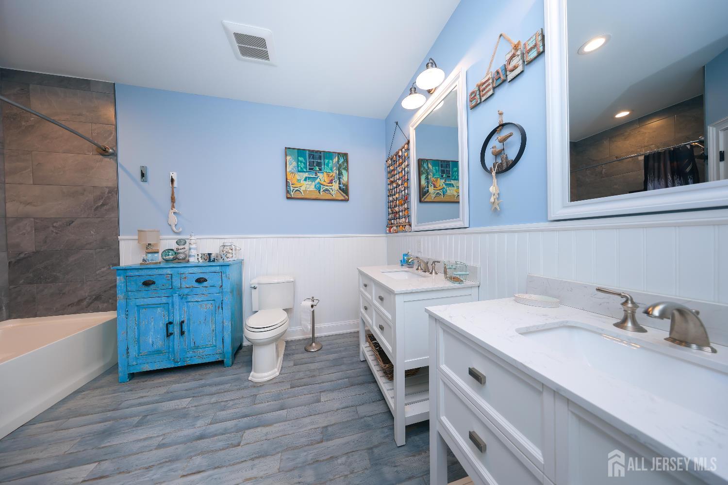 94 East Pleasant Grove Road Jackson, NJ 08527 - Photo 40 of 59 a bathroom with a double vanity sink mirror and bathtub
