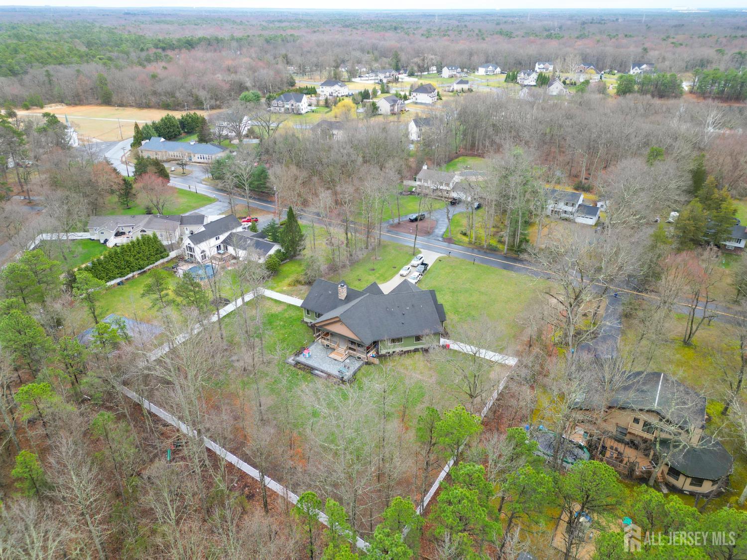 94 East Pleasant Grove Road Jackson, NJ 08527 - Photo 8 of 59 an aerial view of a house with a yard basket ball court and outdoor seating
