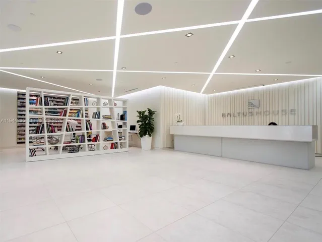 a view of an empty room with storage