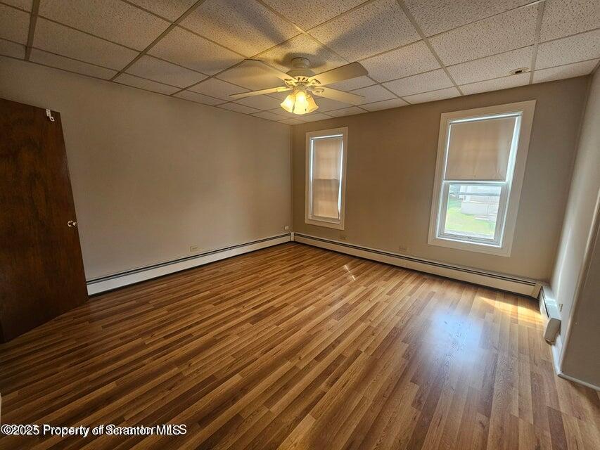 16 Swallow Street, Unit 1 Pittston, PA 18640 - Photo 6 of 14 a view of an empty room with wooden floor and a window