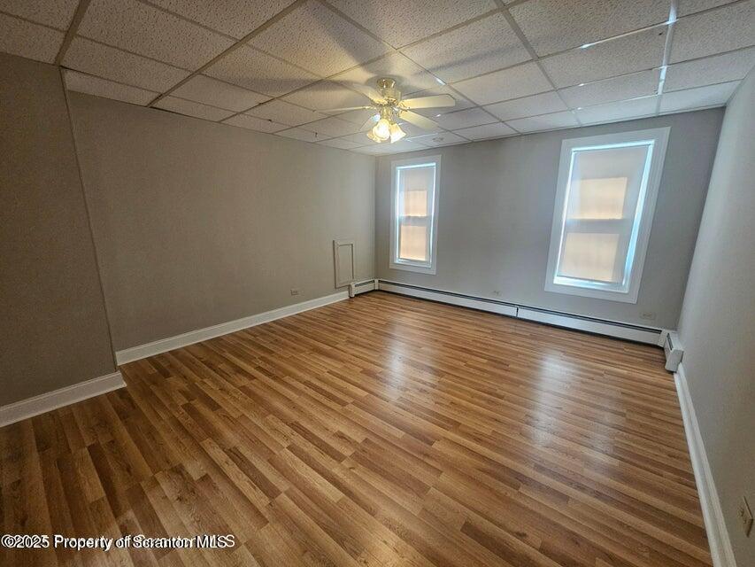 16 Swallow Street, Unit 1 Pittston, PA 18640 - Photo 8 of 14 wooden floor in an empty room with a window