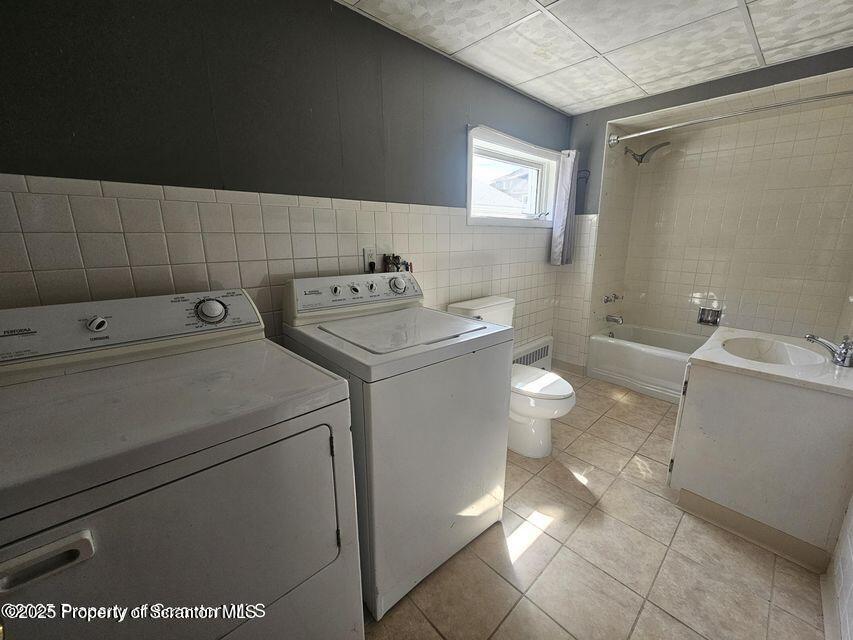 16 Swallow Street, Unit 1 Pittston, PA 18640 - Photo 10 of 14 a bathroom with a sink a toilet and shower