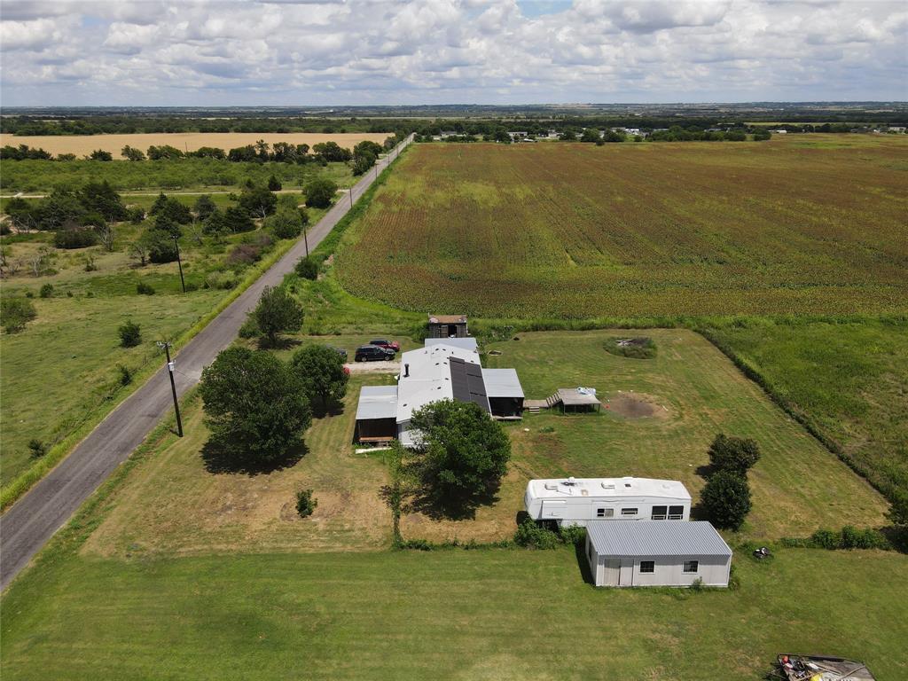 15962 Fritcher Road Pilot Point, TX 76258 - Photo 4 of 24 an aerial view of a house with a ocean view