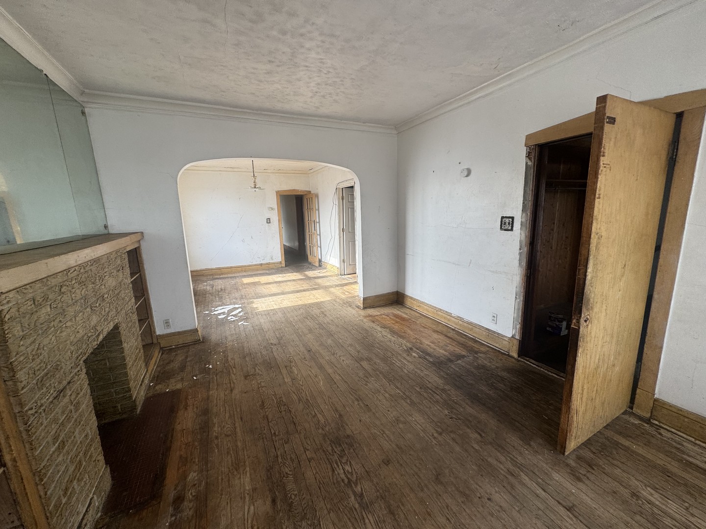 1838 48th Court Cicero, IL 60804 - Photo 7 of 13 a view of a livingroom with wooden floor and a fireplace