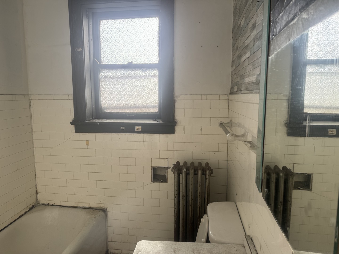 1838 48th Court Cicero, IL 60804 - Photo 10 of 13 a bathroom with a sink and a window