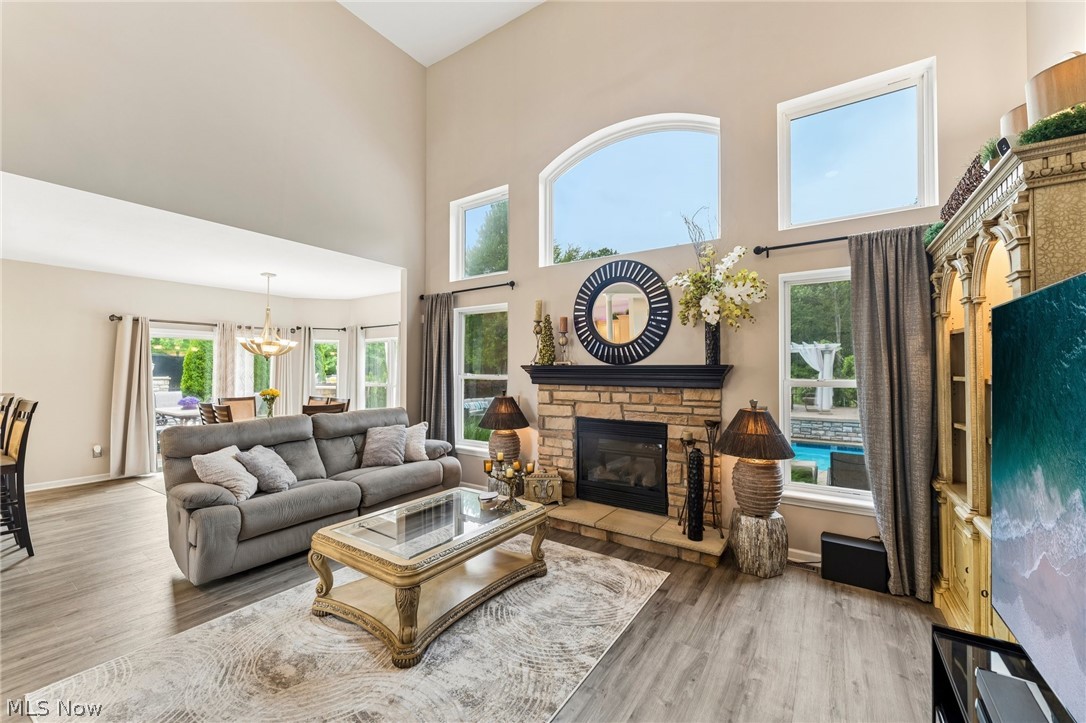8874 Sharp Road Olmsted Falls, OH 44138 - Photo 5 of 42 Vaulted great room featuring a stone fireplace, high ceilings,and large windows