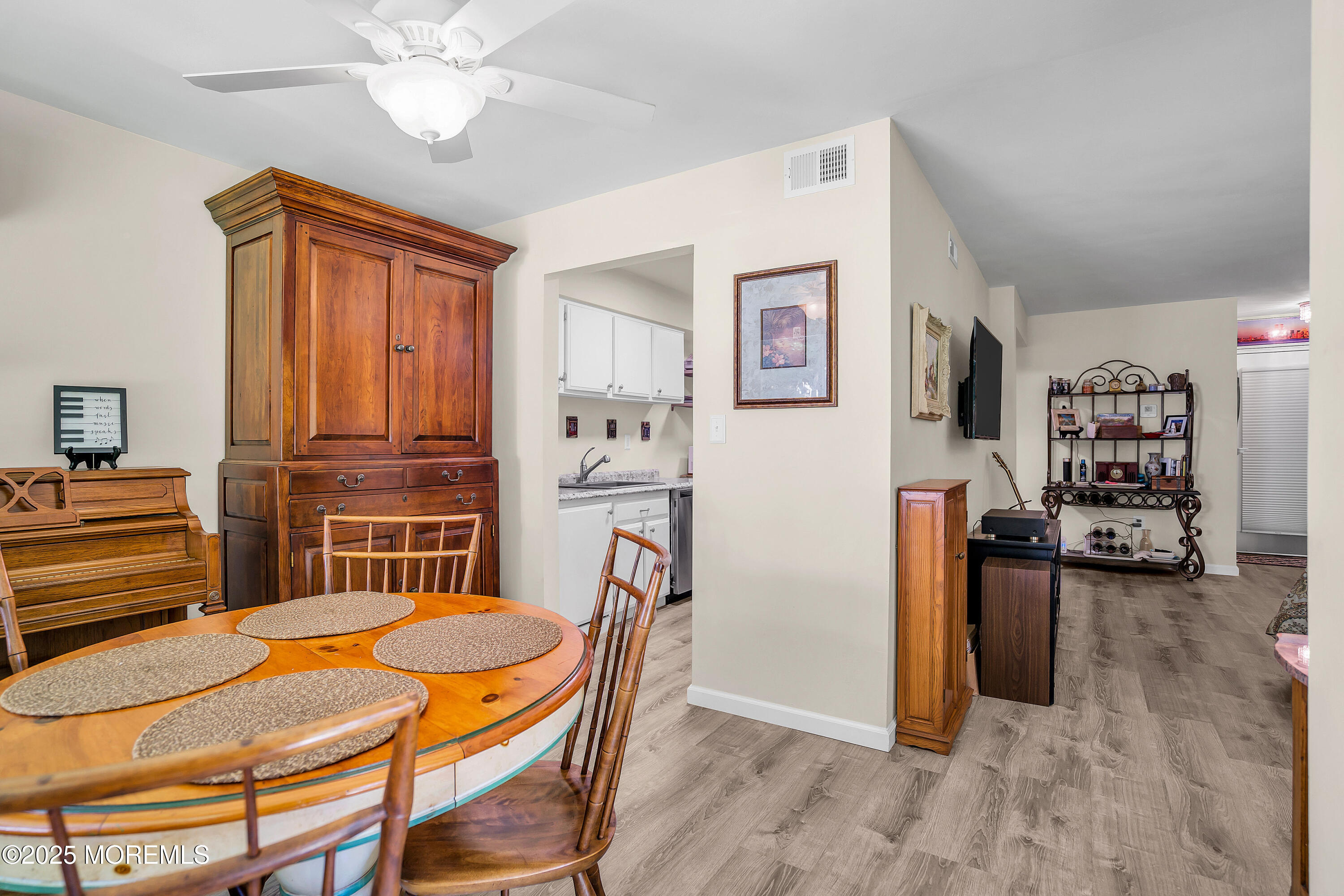 200 Portland Road, Unit E4 Highlands, NJ 07732 - Photo 12 of 37 a dining room with furniture and wooden floor