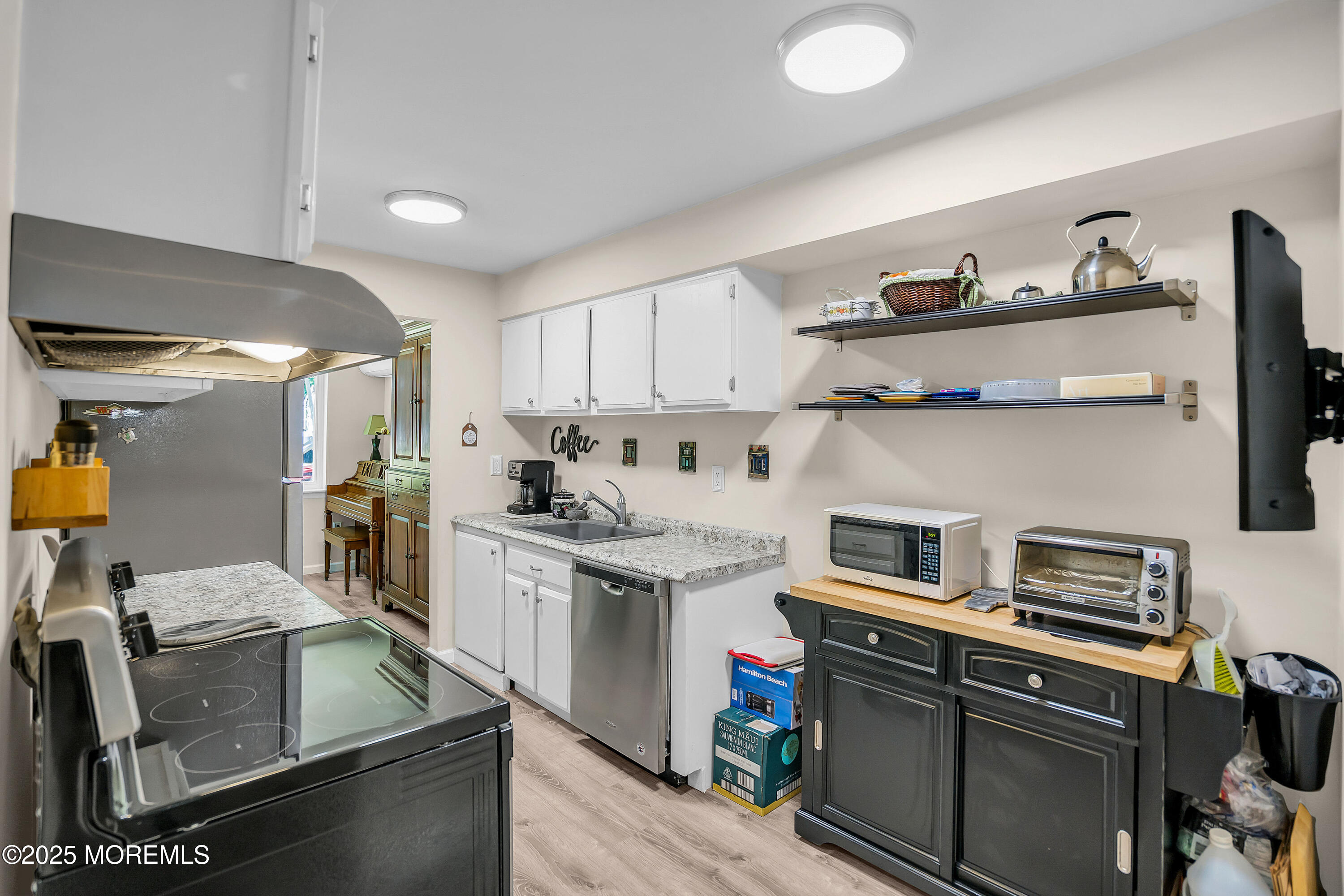 200 Portland Road, Unit E4 Highlands, NJ 07732 - Photo 13 of 37 a kitchen with cabinets and appliances