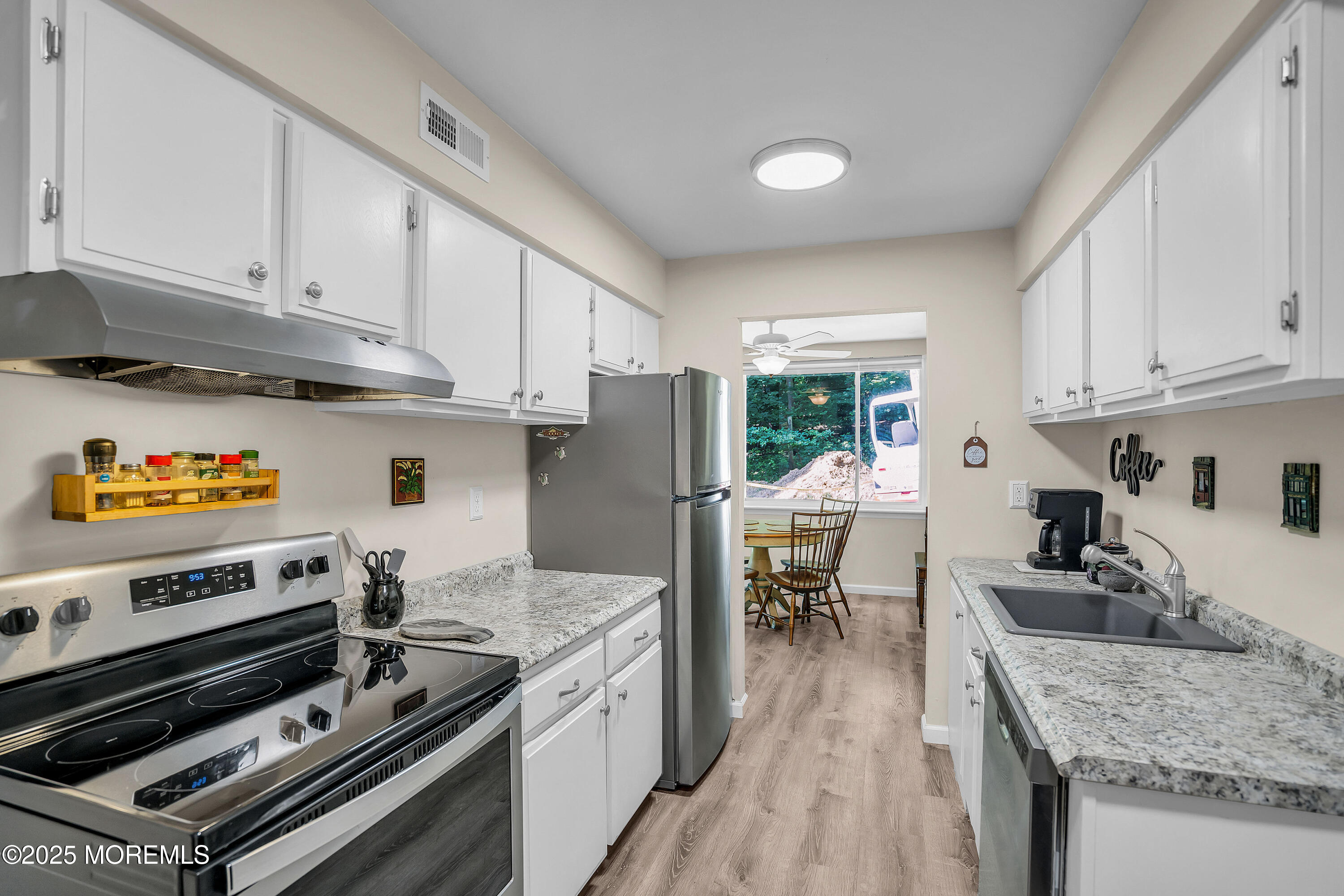 200 Portland Road, Unit E4 Highlands, NJ 07732 - Photo 14 of 37 a kitchen with stainless steel appliances granite countertop a stove a sink dishwasher and a refrigerator