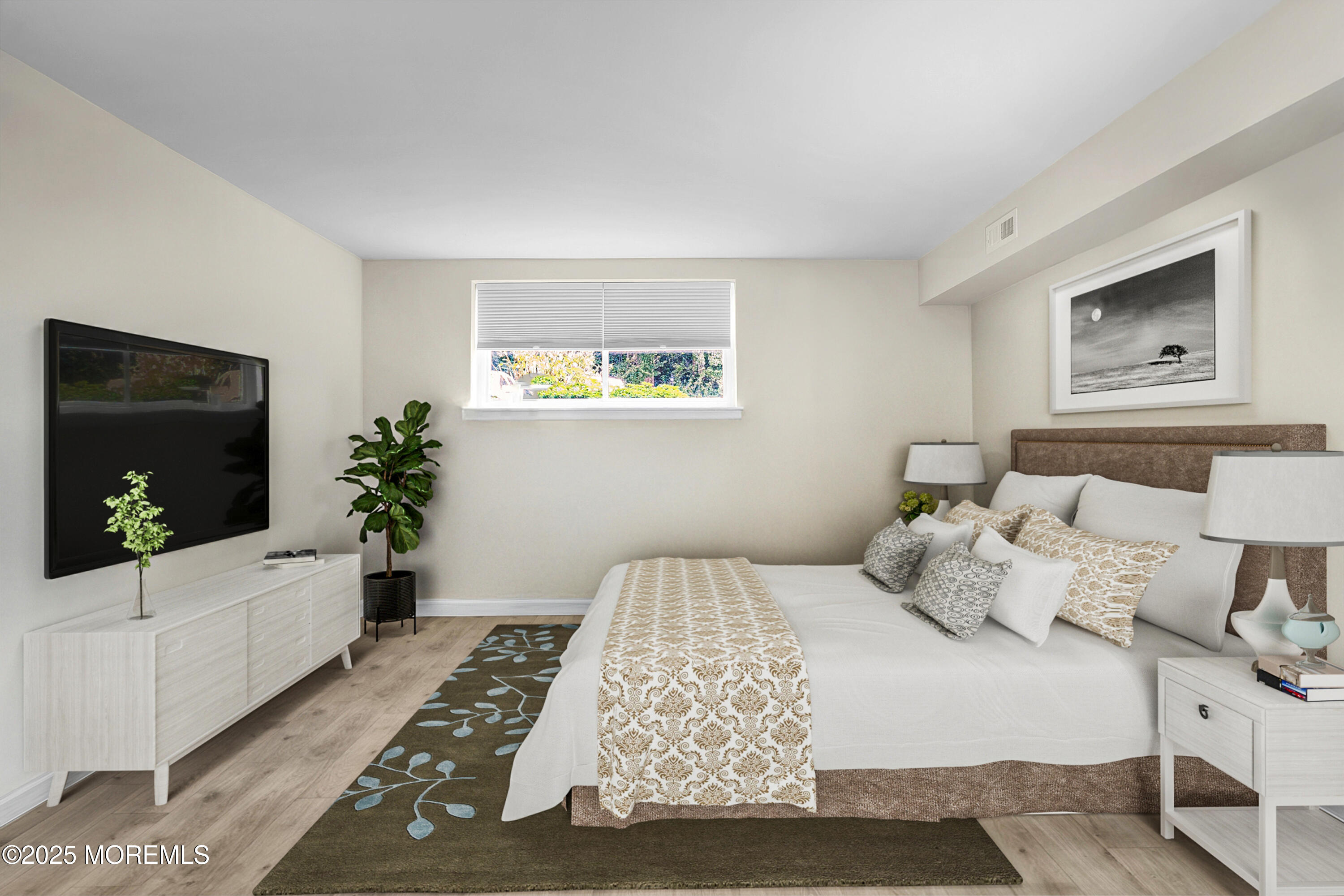 200 Portland Road, Unit E4 Highlands, NJ 07732 - Photo 21 of 37 a bedroom with a large bed and a flat screen tv