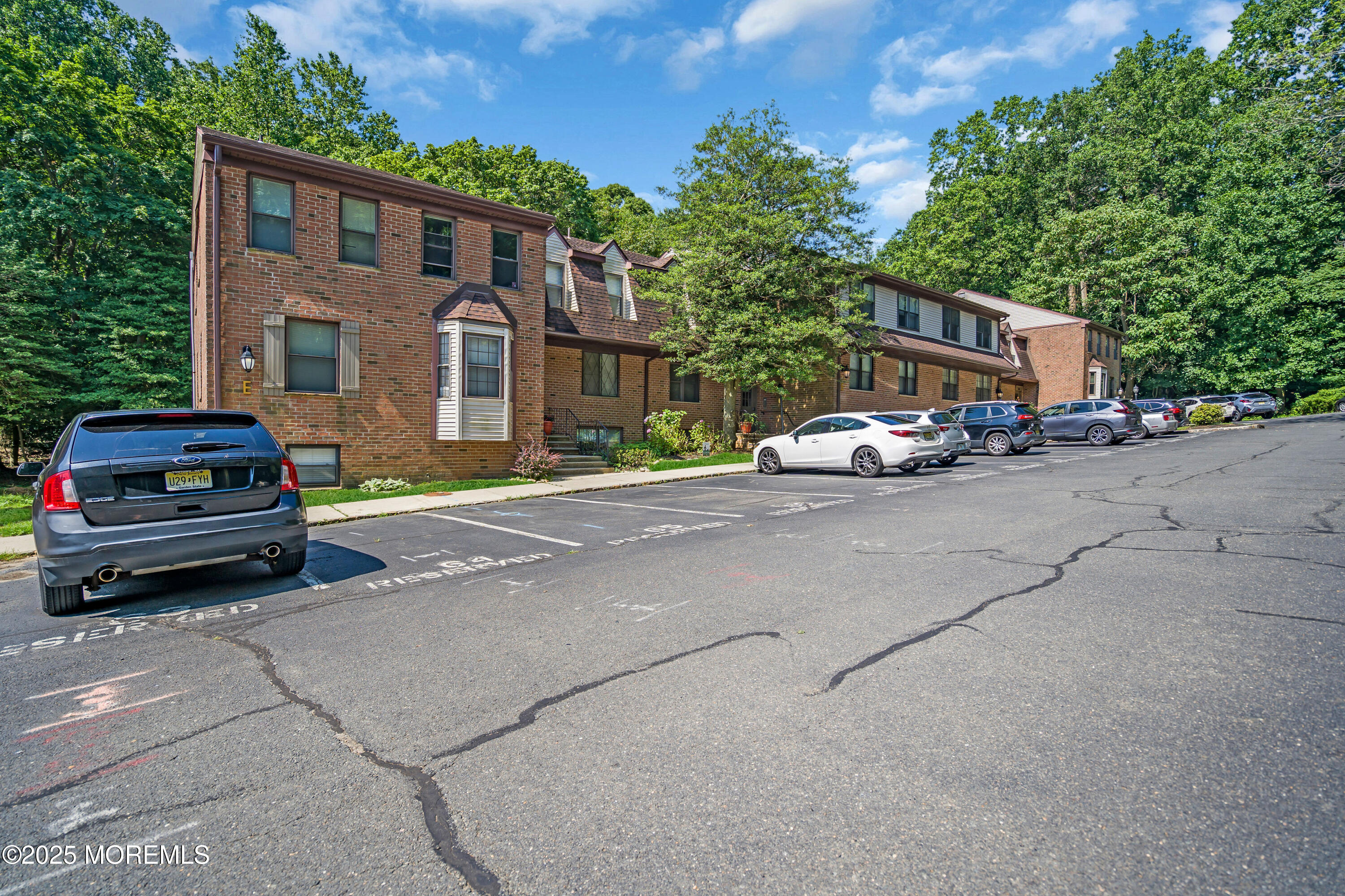 200 Portland Road, Unit E4 Highlands, NJ 07732 - Photo 27 of 37 a car parked in front of a house