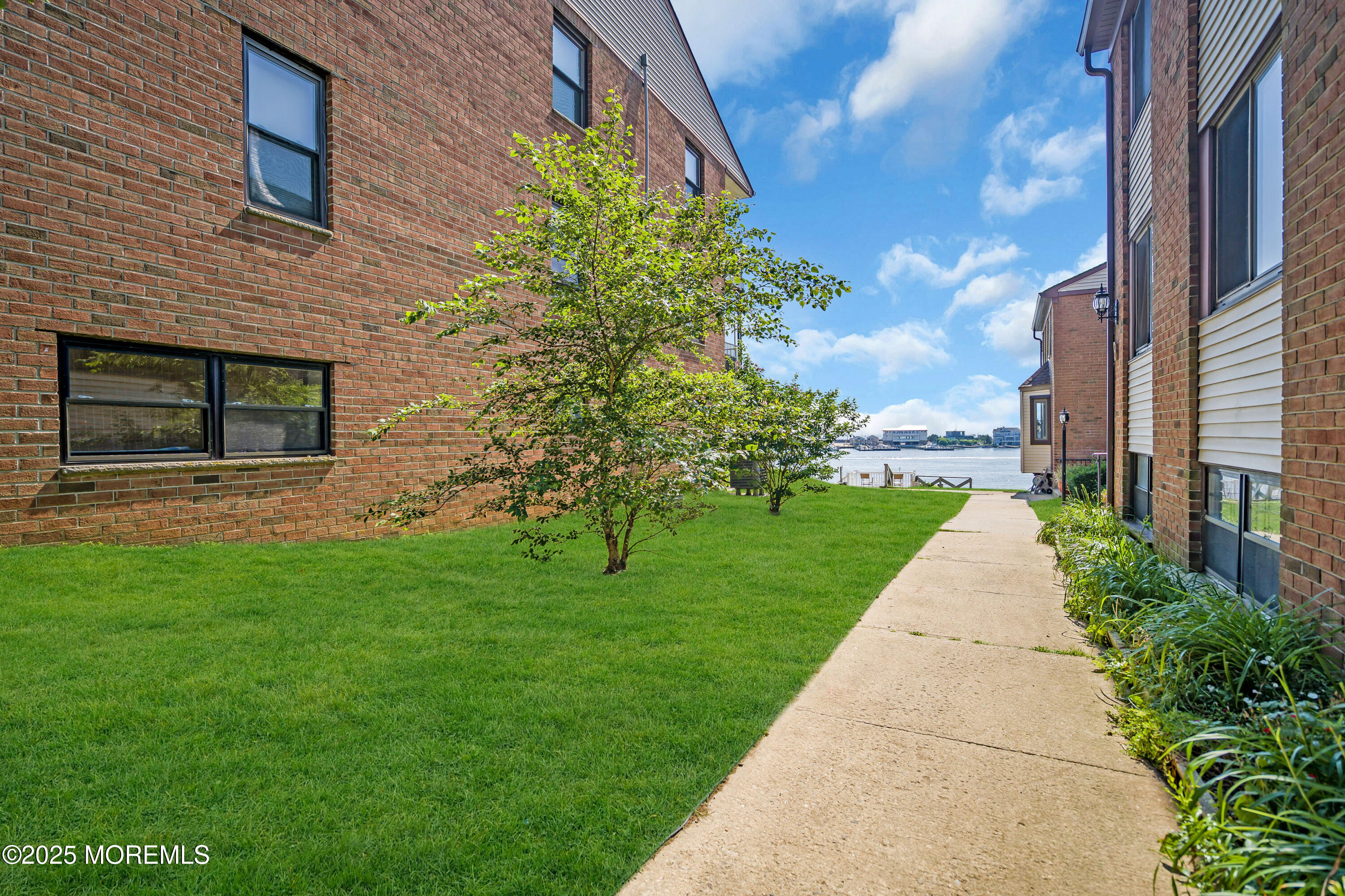 200 Portland Road, Unit E4 Highlands, NJ 07732 - Photo 28 of 37 a view of a pathway with a house in the background