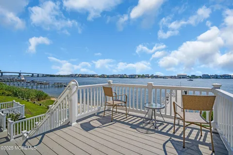 a view of a chairs on wooden deck