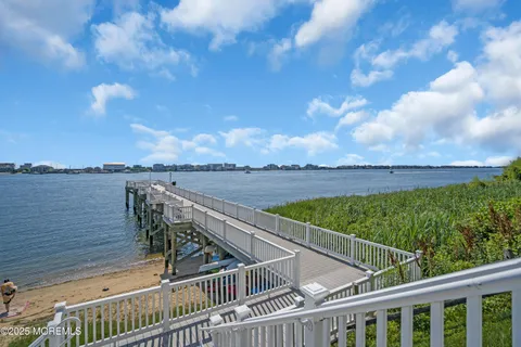 a view of a roof deck with wooden floor and fence