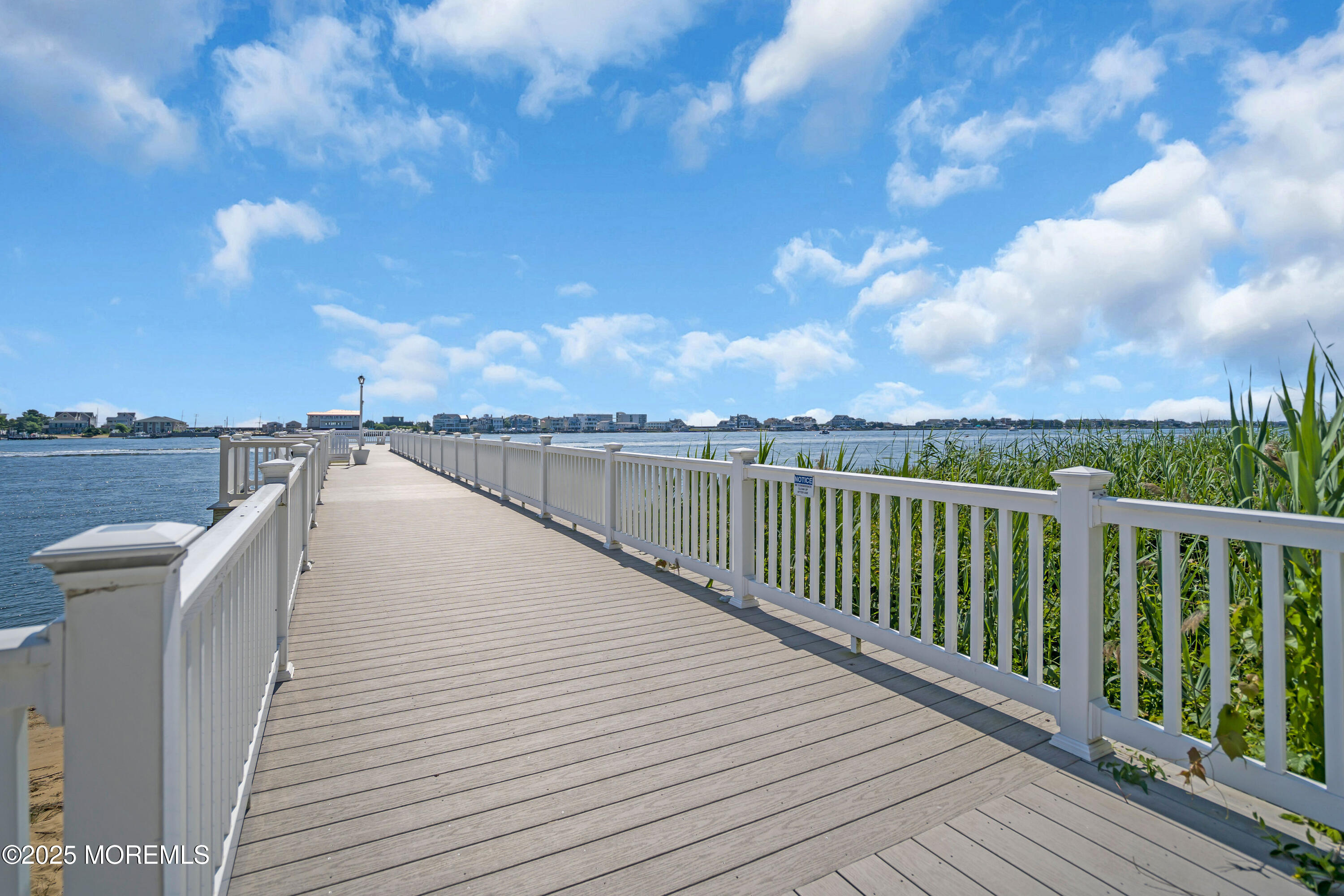 200 Portland Road, Unit E4 Highlands, NJ 07732 - Photo 31 of 37 a view of a balcony with wooden floor & fence