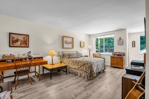 a bedroom with furniture and a window