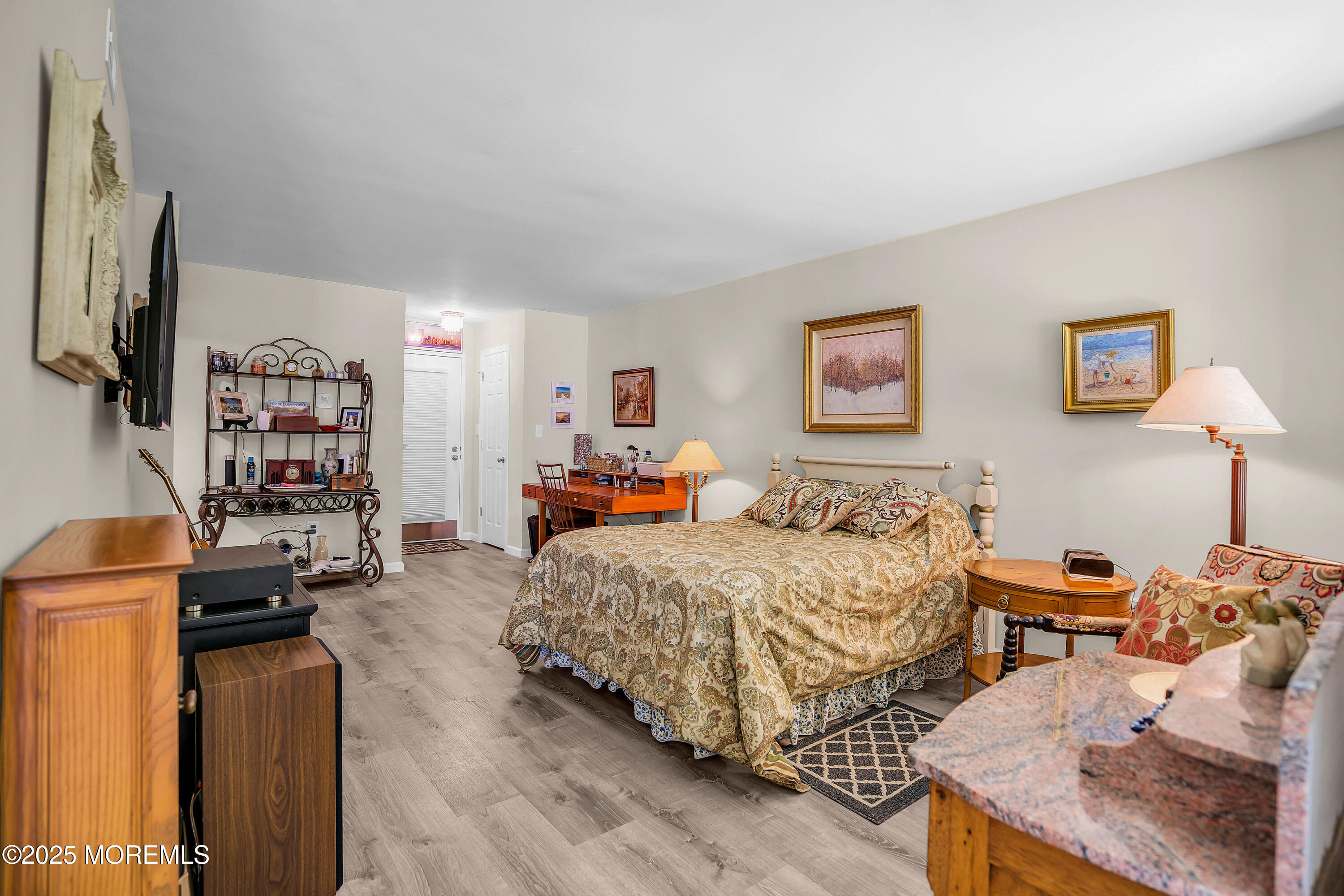 200 Portland Road, Unit E4 Highlands, NJ 07732 - Photo 7 of 37 a bedroom with a bed furniture and a flat screen tv