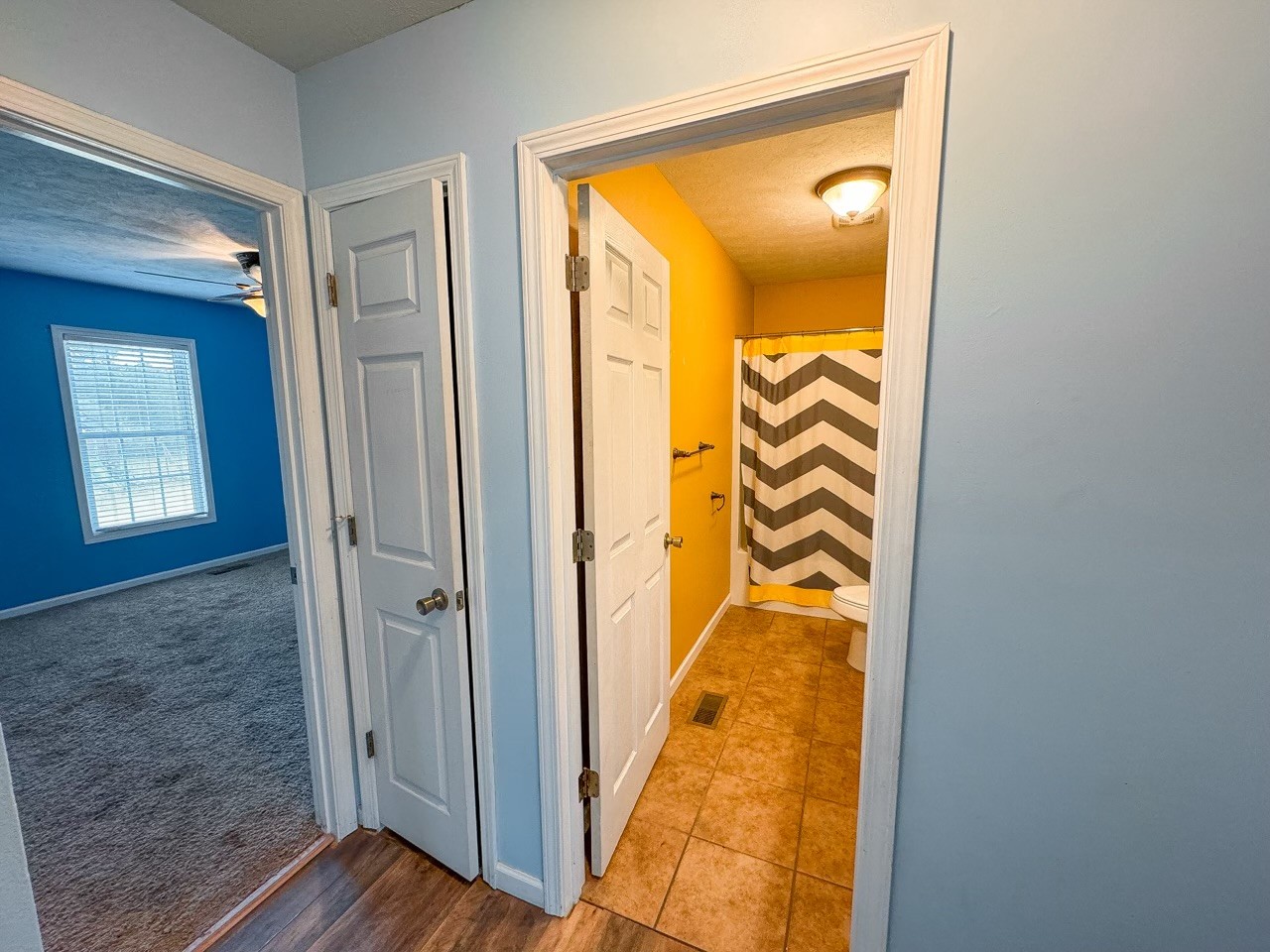 35 Whitaker Bend Road Linden, TN 37096 - Photo 17 of 36 a view of a hallway with wooden floor and a bathroom