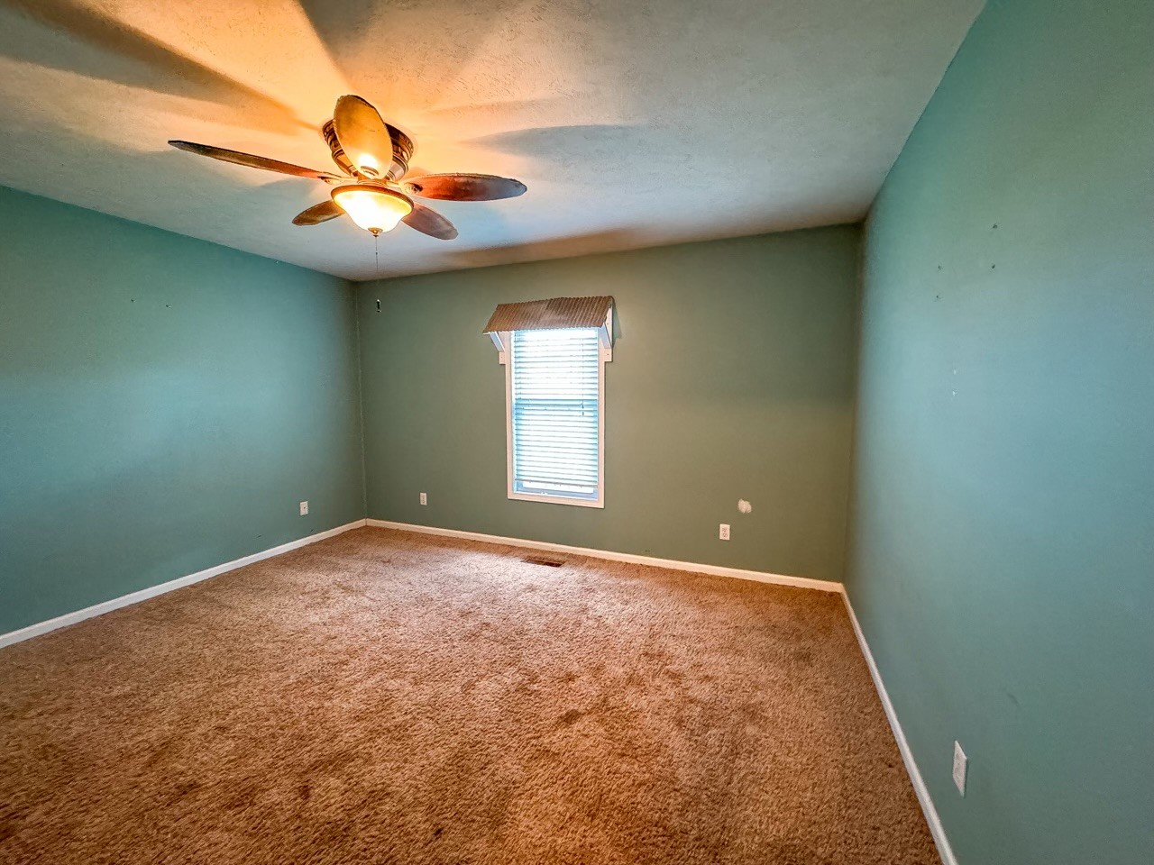 35 Whitaker Bend Road Linden, TN 37096 - Photo 20 of 36 en empty room with windows and fan