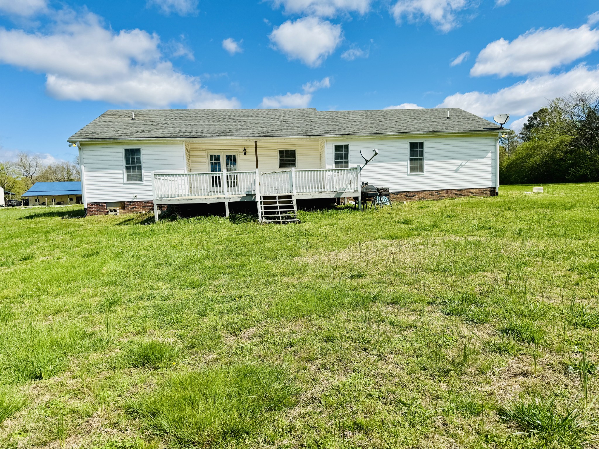 35 Whitaker Bend Road Linden, TN 37096 - Photo 25 of 36 a view of a house with a backyard