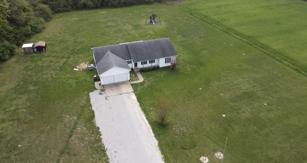 35 Whitaker Bend Road Linden, TN 37096 - Photo 36 of 36 an aerial view of a house with a garden