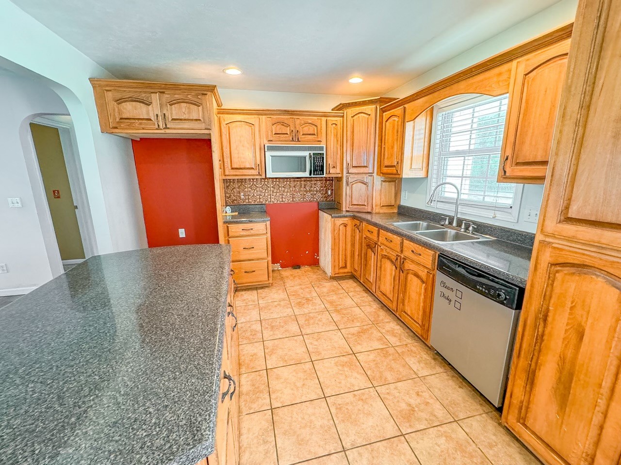 35 Whitaker Bend Road Linden, TN 37096 - Photo 4 of 36 a kitchen with stainless steel appliances granite countertop a refrigerator a stove top oven and a sink with granite countertops