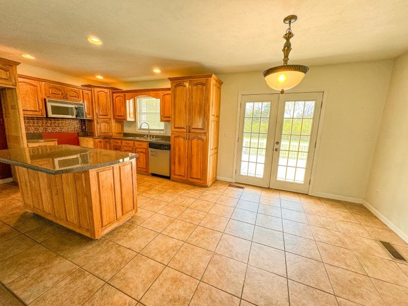 35 Whitaker Bend Road Linden, TN 37096 - Photo 5 of 36 a view of a kitchen with stainless steel appliances a sink and cabinets