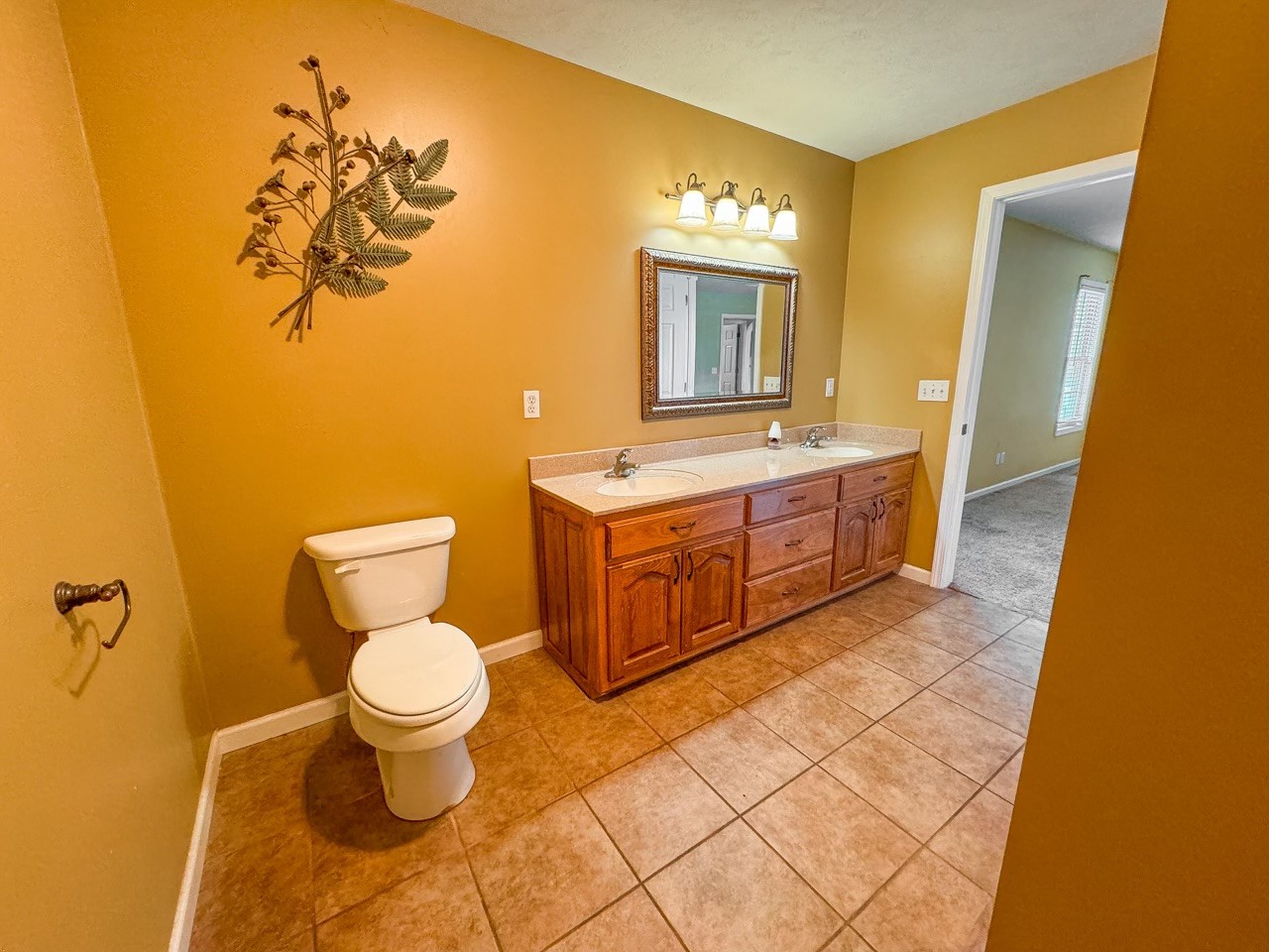 35 Whitaker Bend Road Linden, TN 37096 - Photo 10 of 36 a bathroom with a toilet sink and mirror