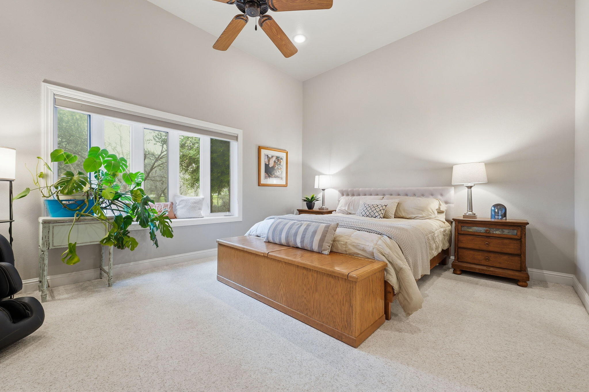 13482 Tierra Heights Road Redding, CA 96003 - Photo 16 of 41 a bedroom with a bed table and a chair